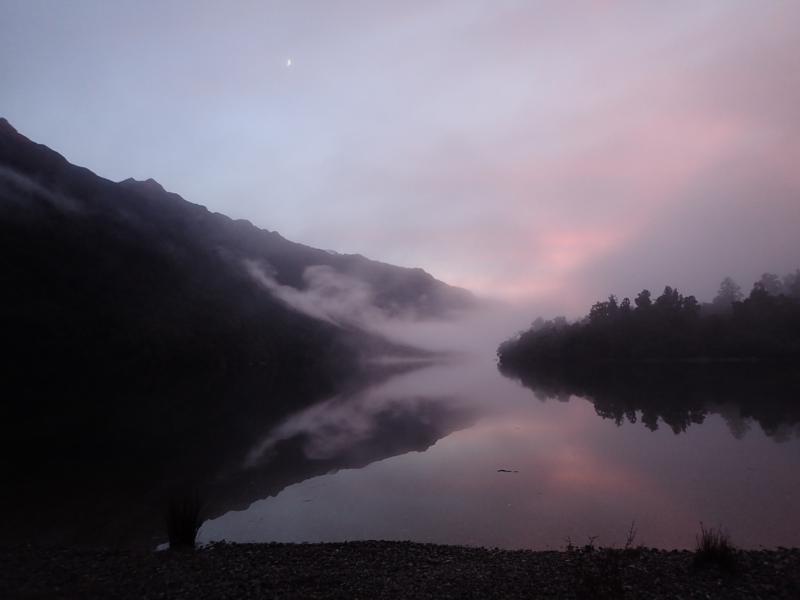 pink and misty light on a lake