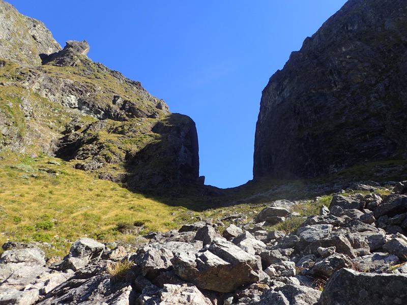 a narrow u shaped notch between 2 mountains
