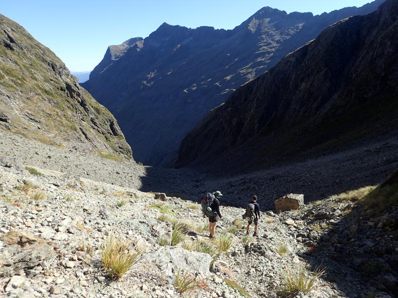 hikers descending a rocky slope
