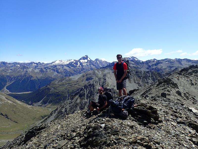 2 hikers on top of a rocky mountain