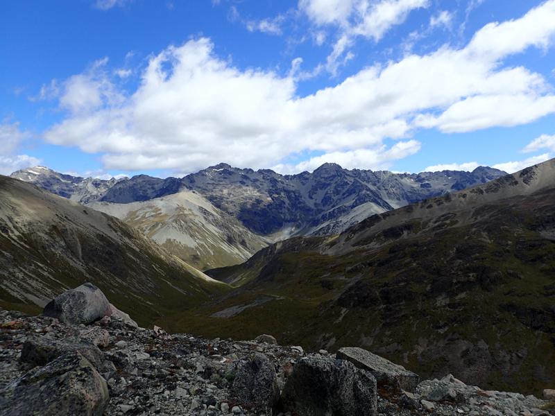 a valley with mountains beyond