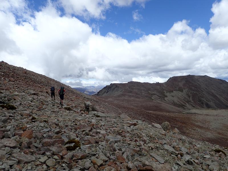 2 hikers walking along a rocky ridge