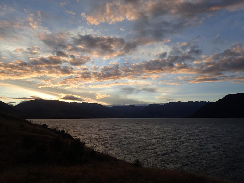 Evening lake view with bright dramatic cloud formations
