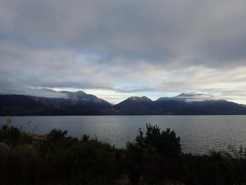 Lake view with cloudy mountains behind