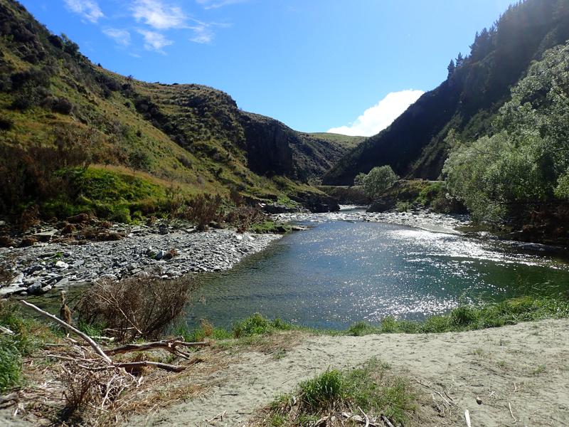 River stretching up a gorge in sunshine