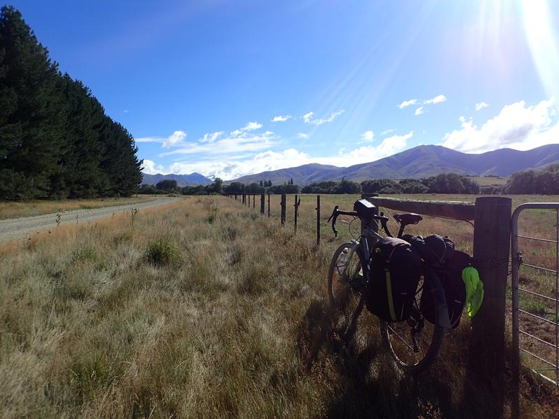 Gravel road with bike and blue sky